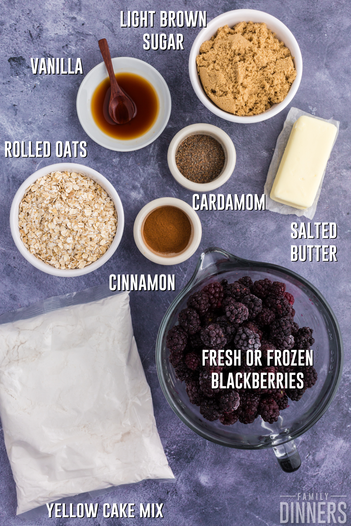 dark gray countertop with bowls of ingredients for blackberry dump cake