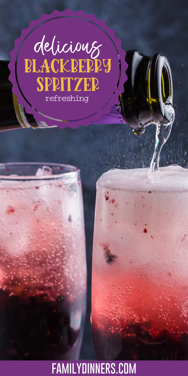 photo of two champagne glasses filled with blackberry cocktail that's dark purple on bottom and lighter pink on top. Text says blackberry spritzer recipe