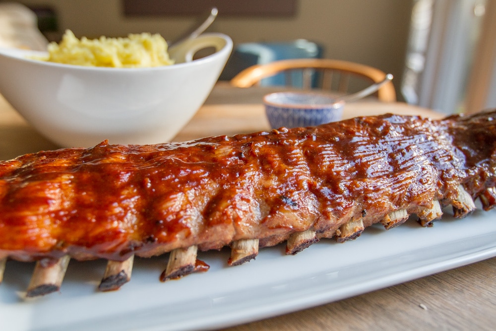 bbq ribs on a plate with sides