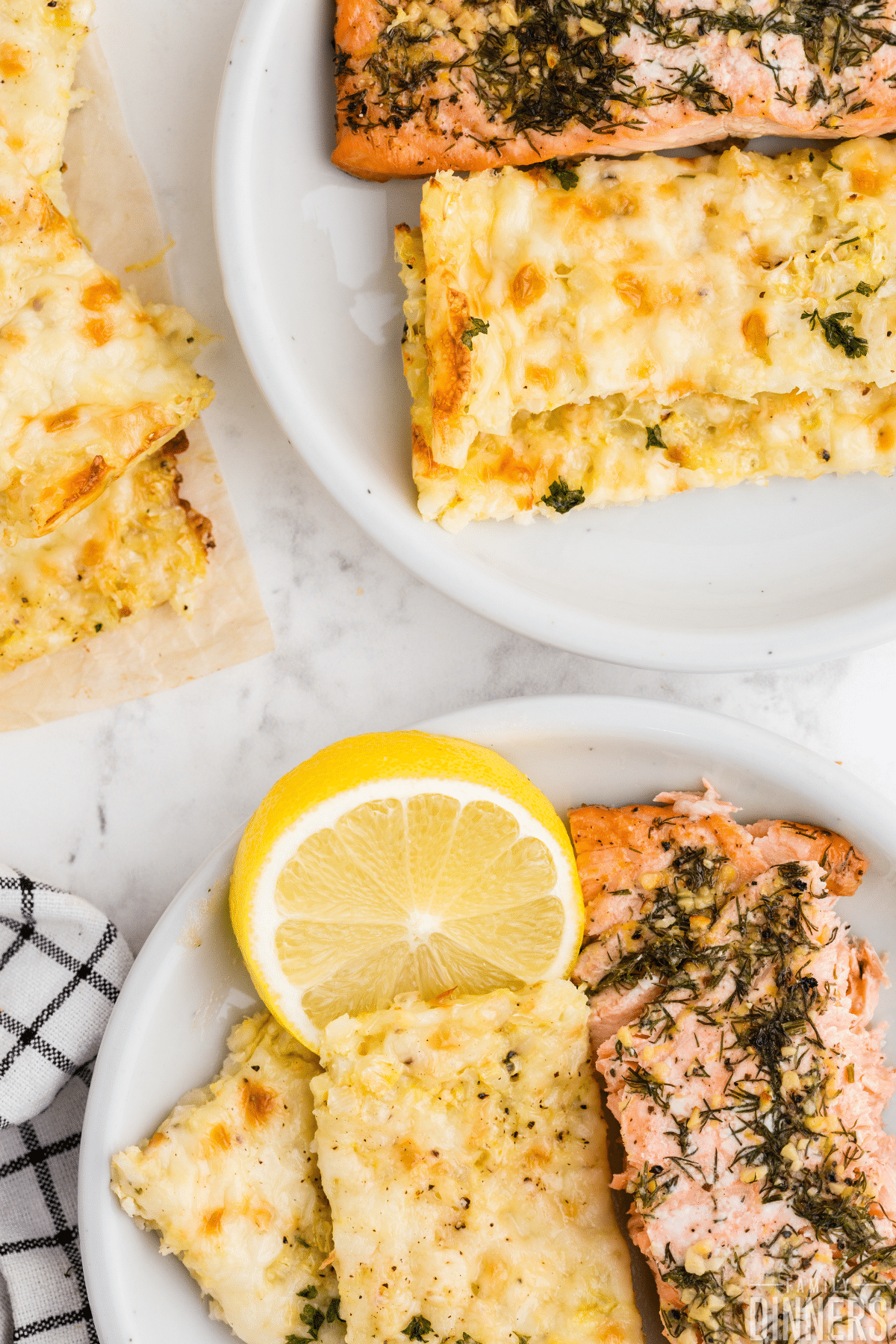 plate with cauliflower breadsticks and salmon