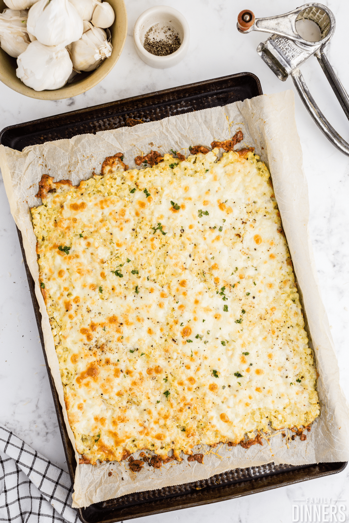 cauliflower breadsticks on baking sheet