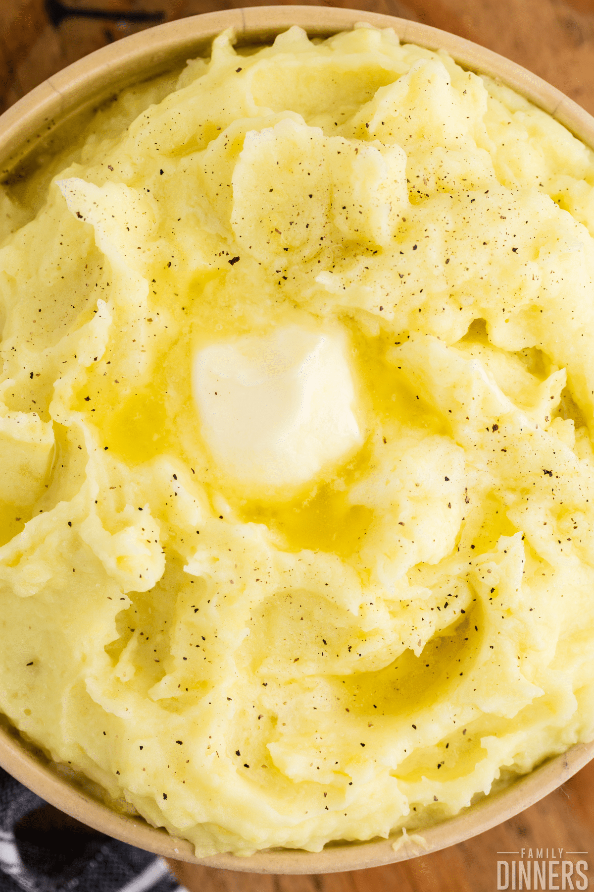 bowl of fluffy mashed potatoes with butter