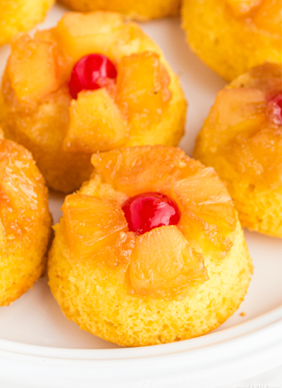 pineapple upside down mini cakes on a white plate