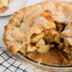 granny smith apple pie with one slice missing