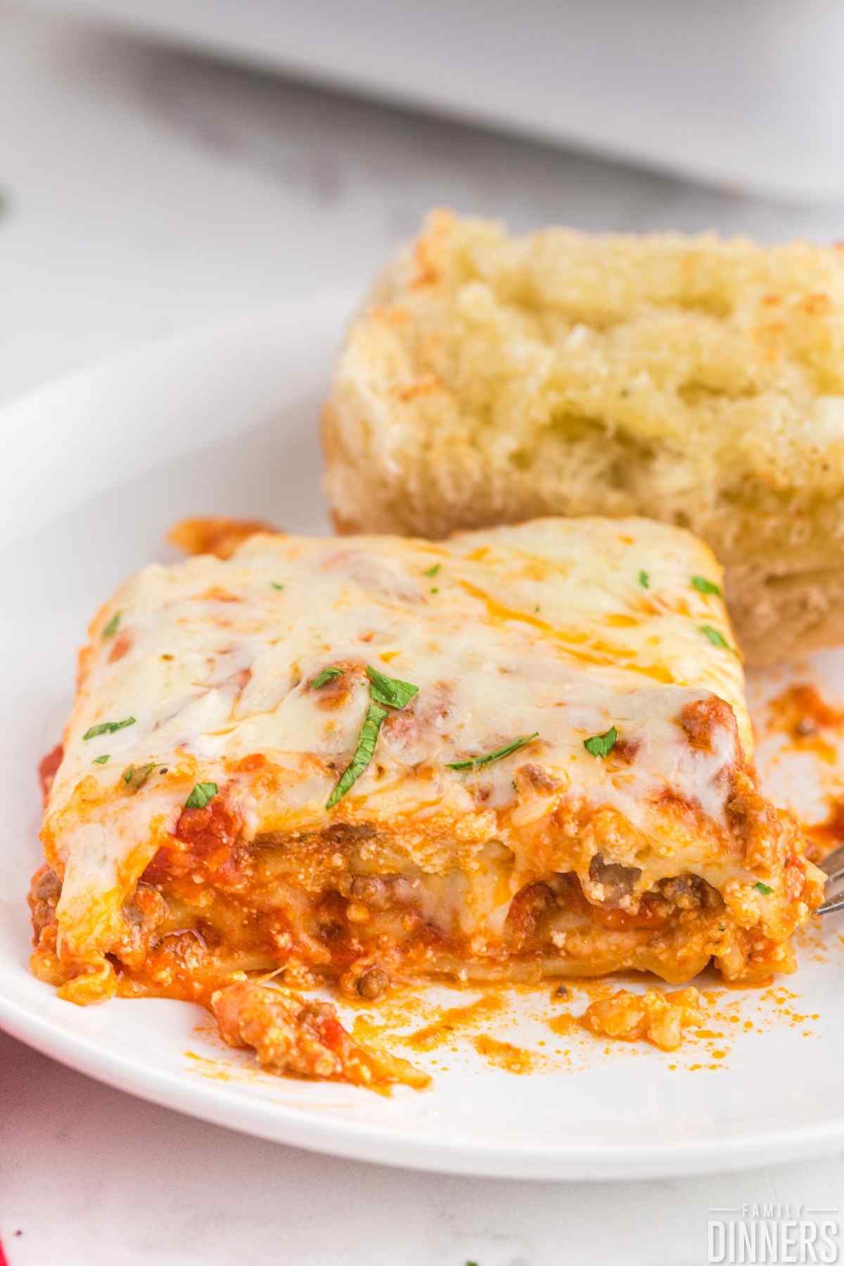 one slice of lasagna on a plate