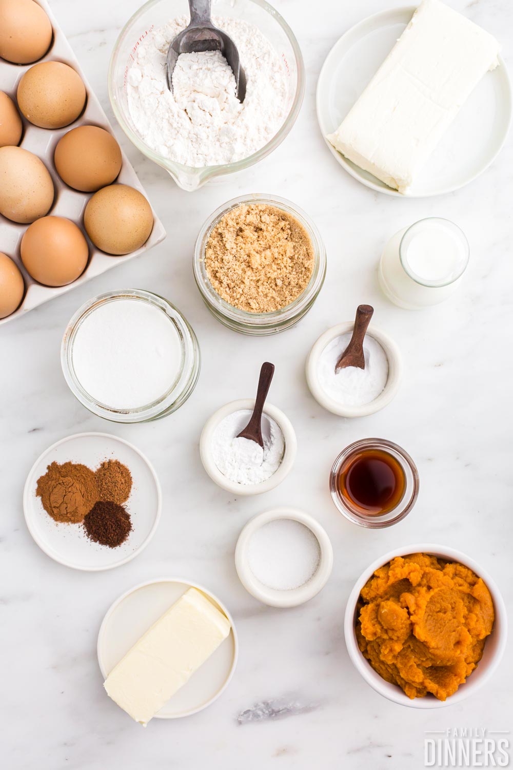 cream cheese pumpkin muffin ingredients on white background