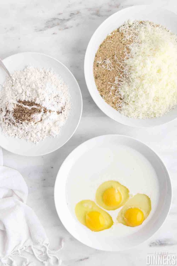3 shallow dishes of flour/salt, egg/milk, breadcrumb/parmesan