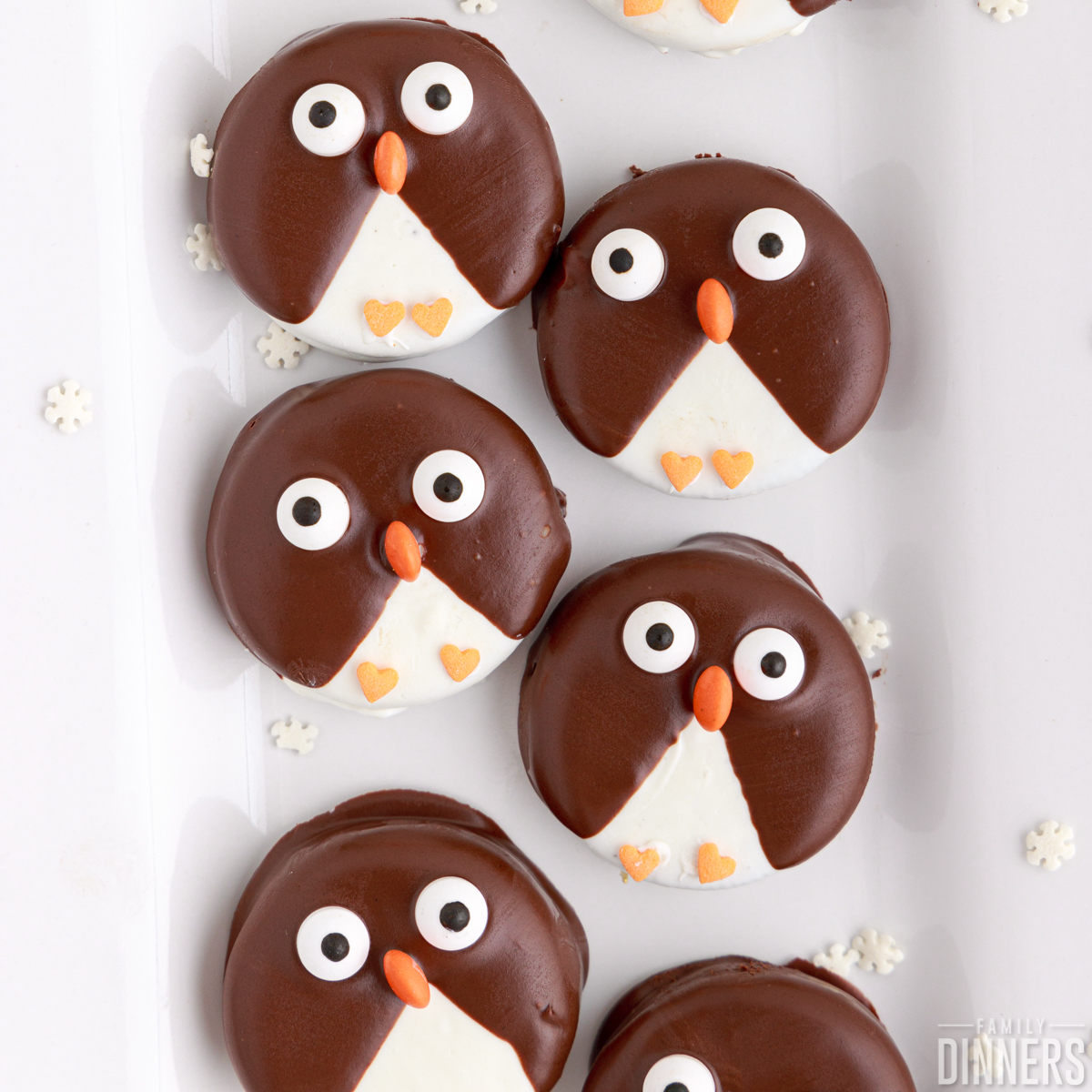 rows of penguin decorated cookies