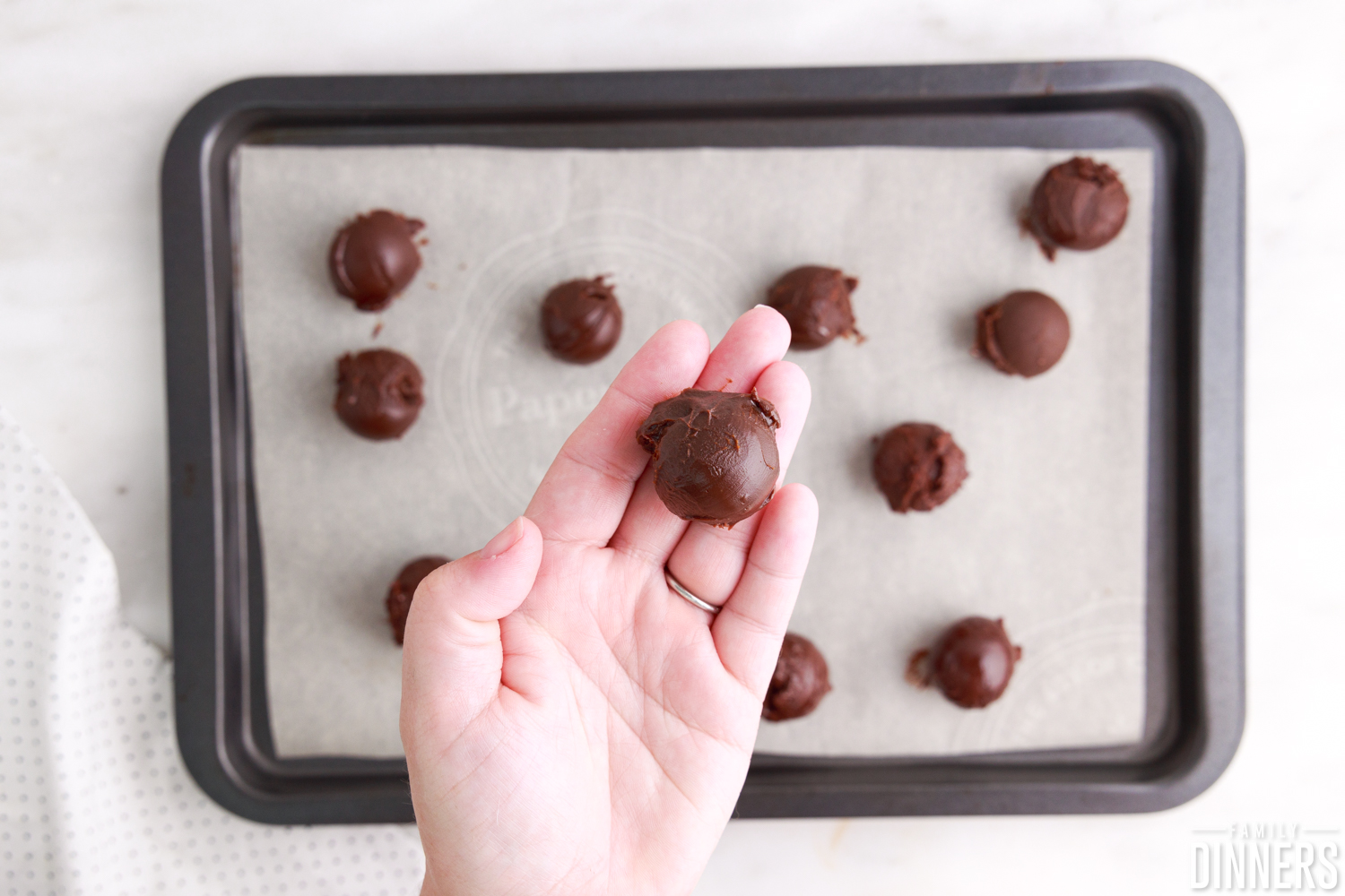 chocolate truffle on hand
