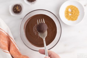 truffle on a fork over melted chocolate