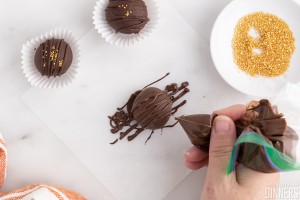 chocolate being drizzled on truffle