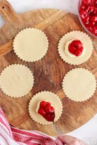 cherry filling on top of cheese mix on pie crust
