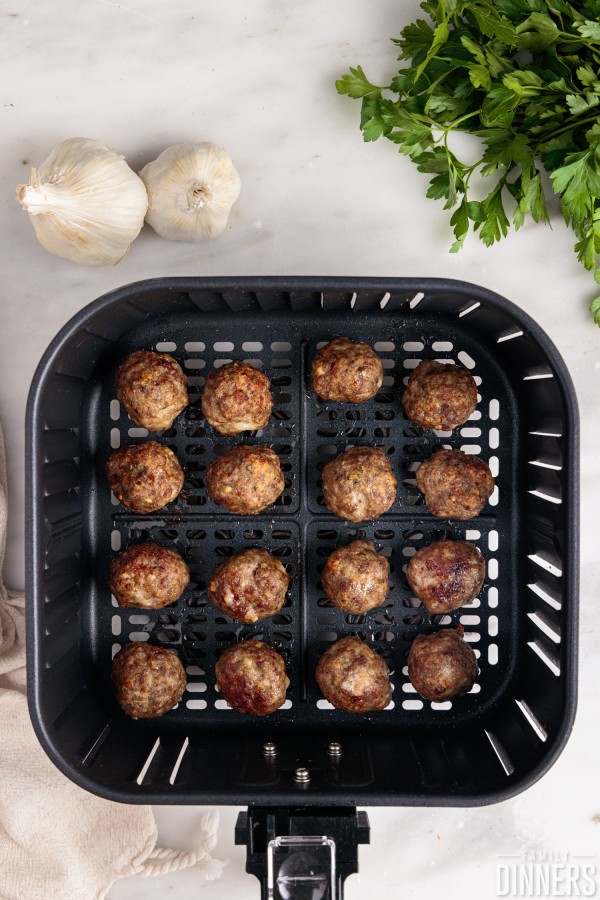 cooked meatballs in an air fryer