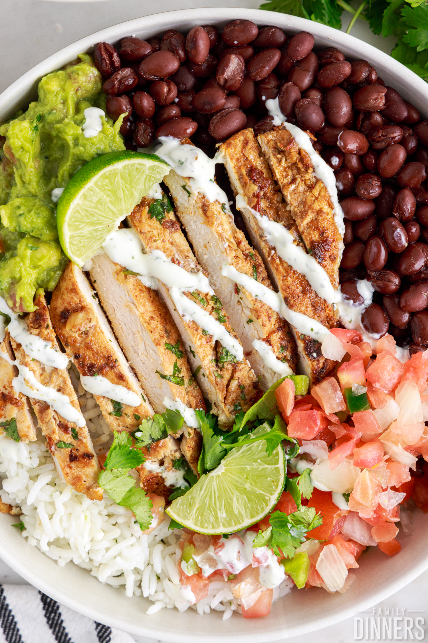 chipotle chicken burrito bowl drizzled with sour cream