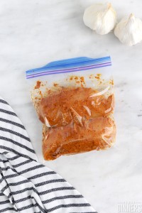 two chicken breasts in ziplock with chipotle marinade