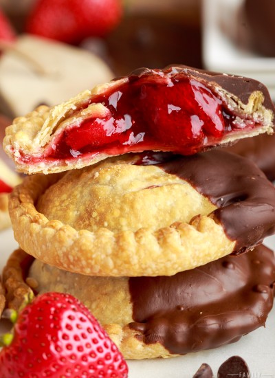 stack of chocolate dipped strawberry hand pies cooked in air fryer