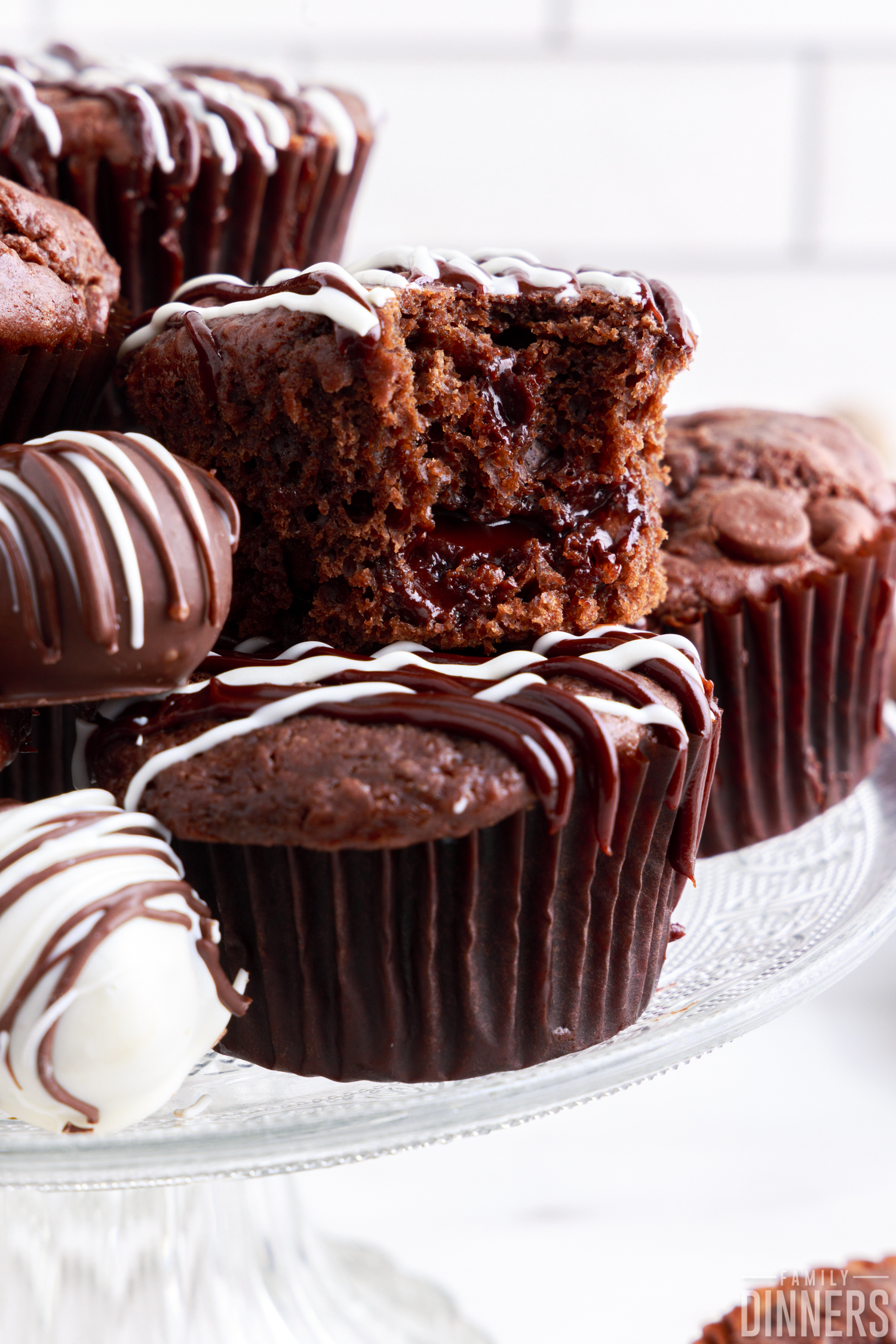 chocolate lava muffins on a cake stand with dark chocolate truffles