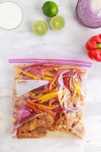 ziplock with chicken and vegetables marinating
