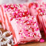 piece of pink and red swirled fudge with sprinkles
