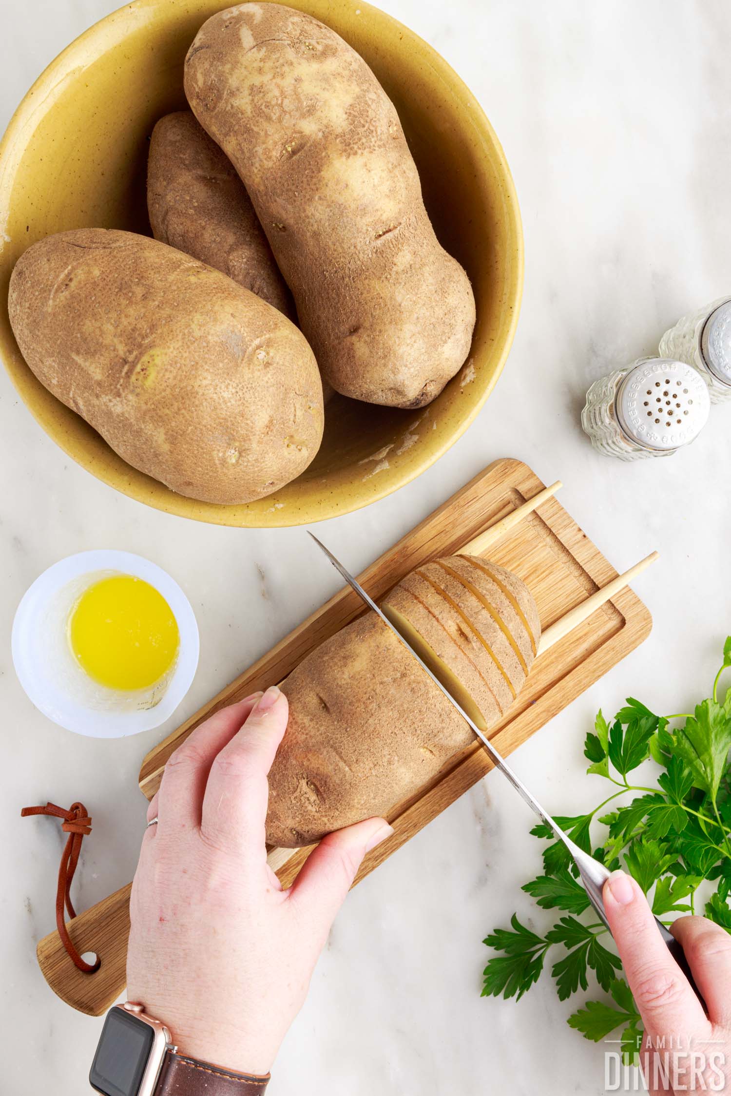 knife slicing across potato