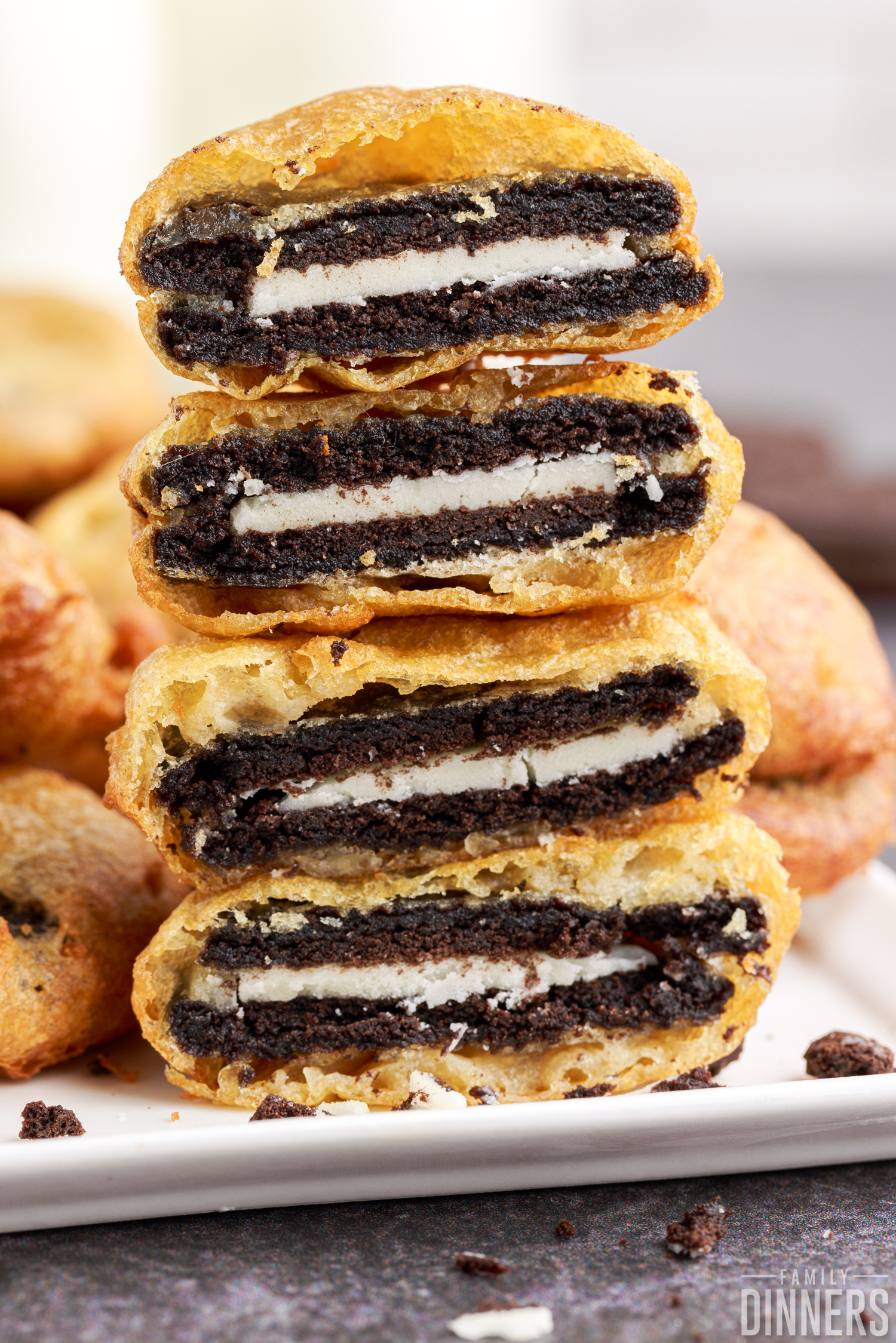 deep fried oreos stacked up and cut in half