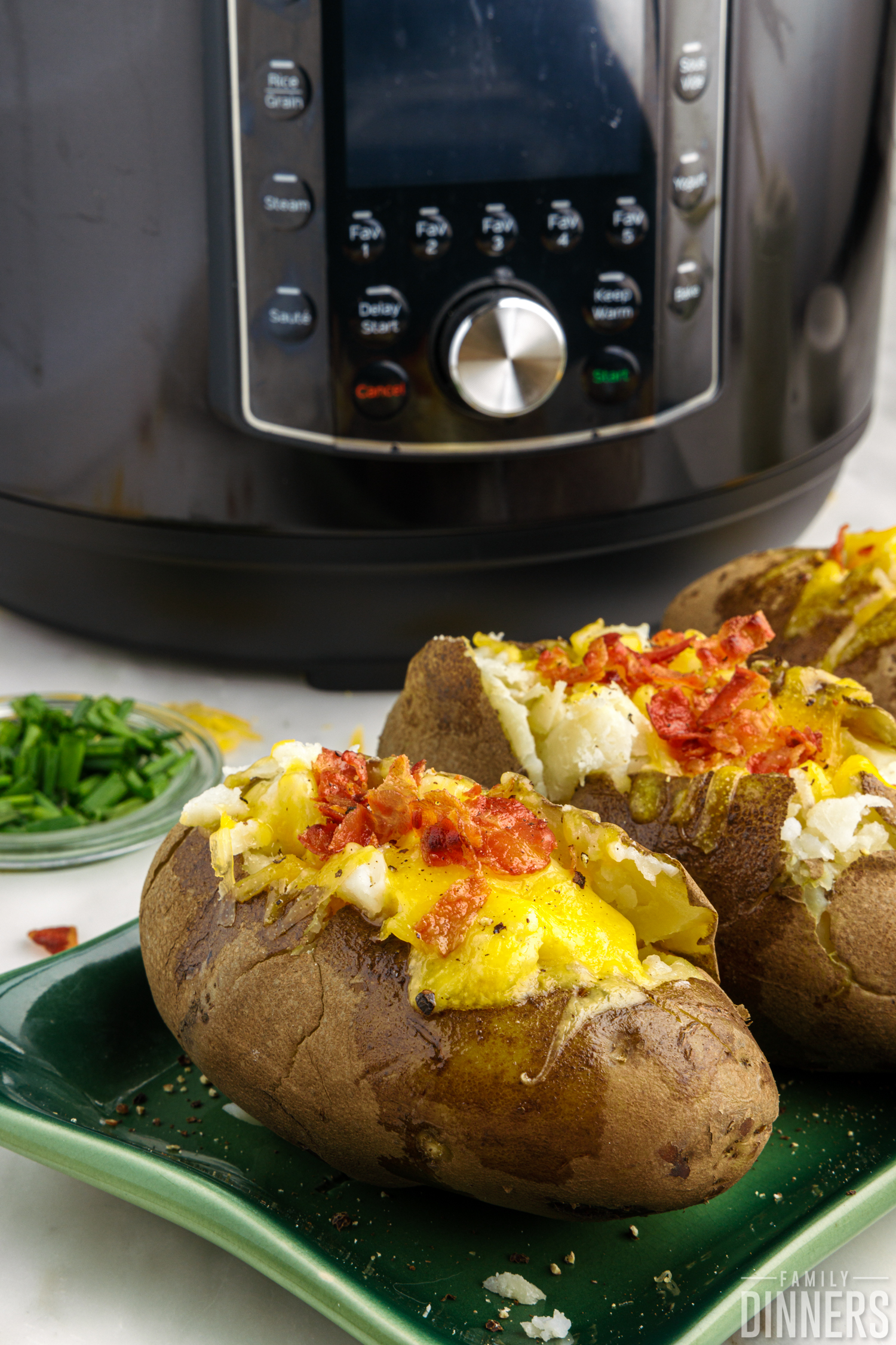 baked potatoes in front of the instant pot