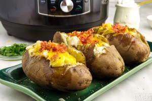 fully cooked baked potatoes stuffed with cheddar cheese and bacon.