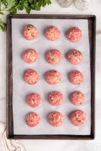 baking sheet with 3 rows of 5 meatballs