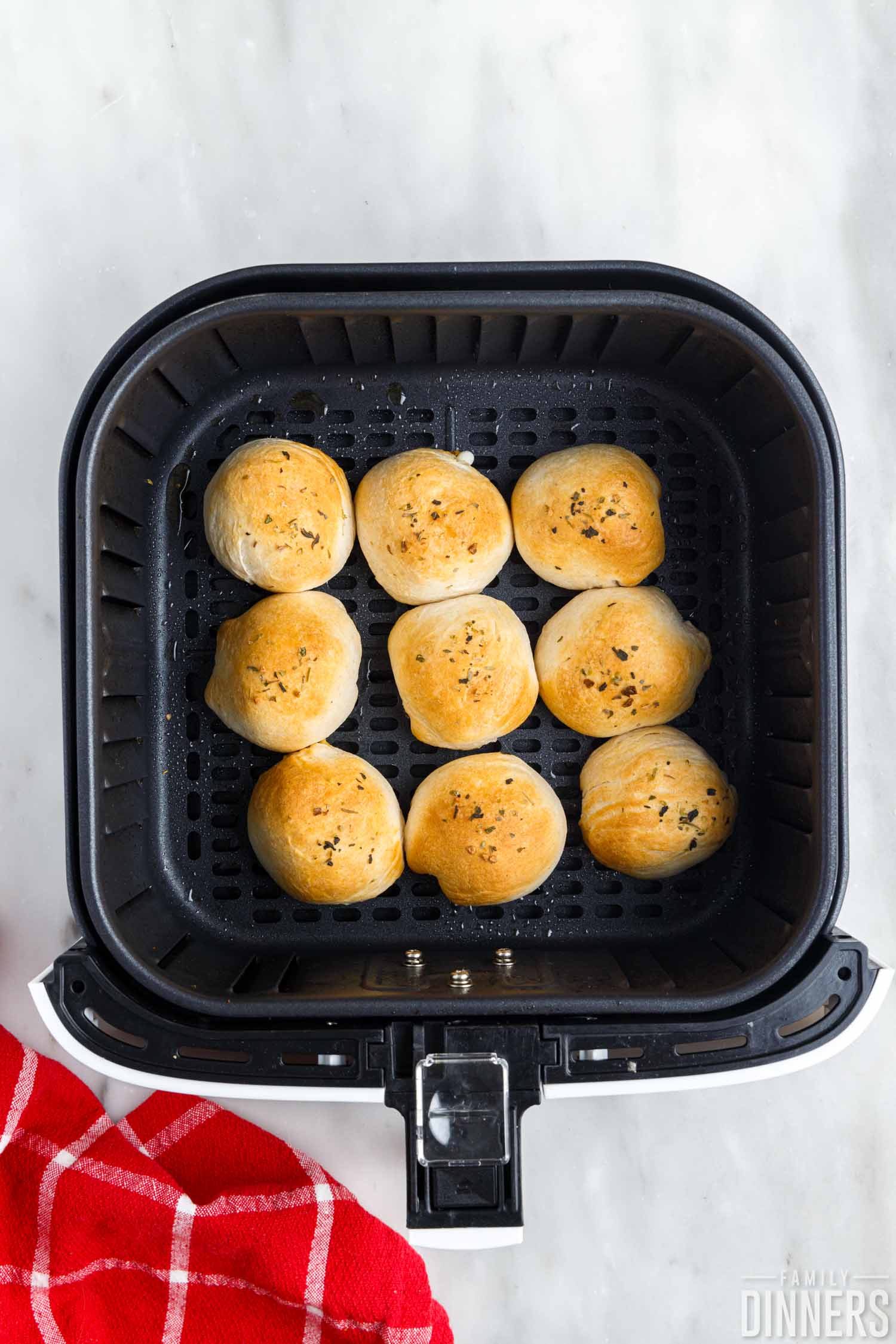 cooked 3 cheese bombs in air fryer basket.