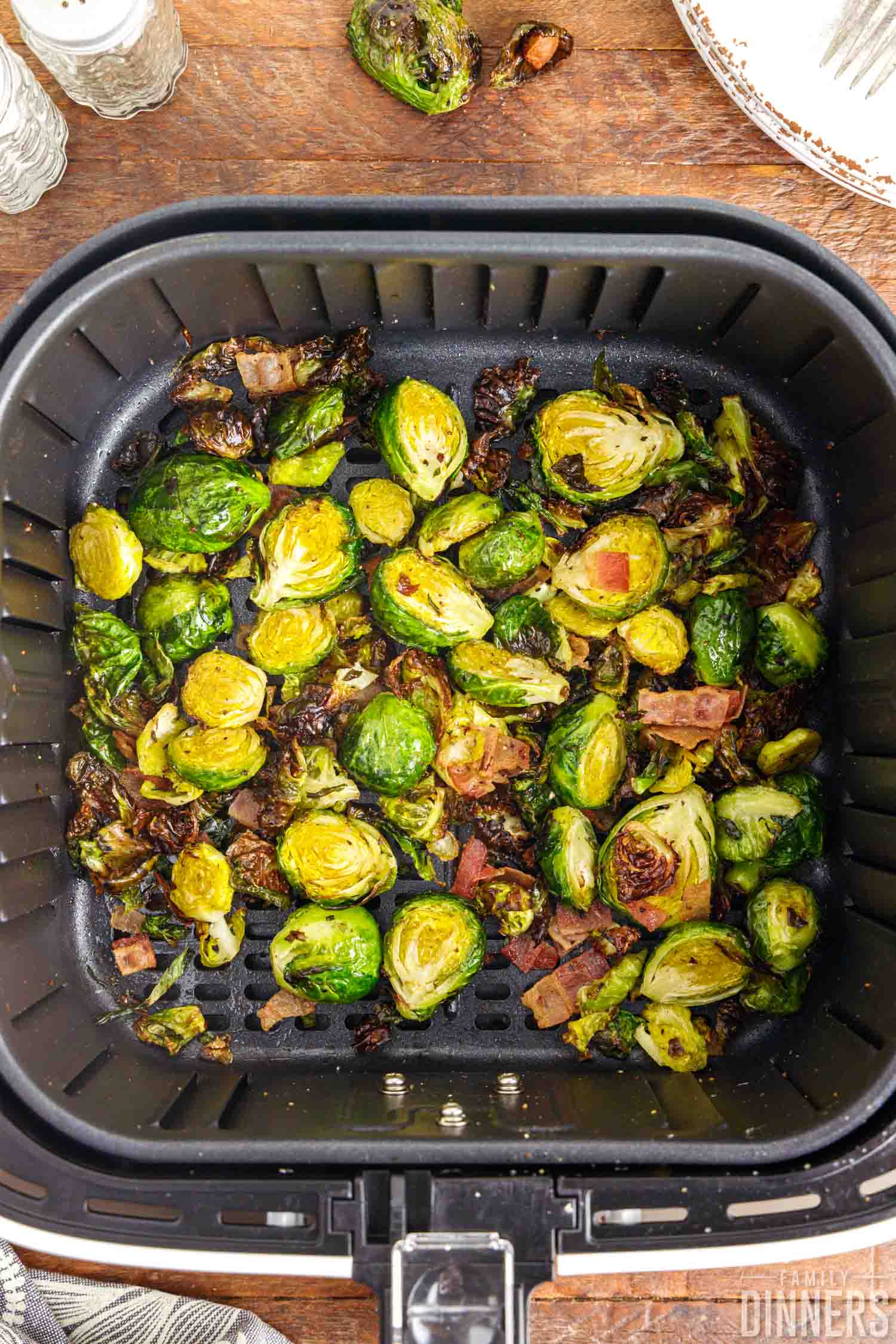 air fryer brussels sprouts with bacon in an air fryer.