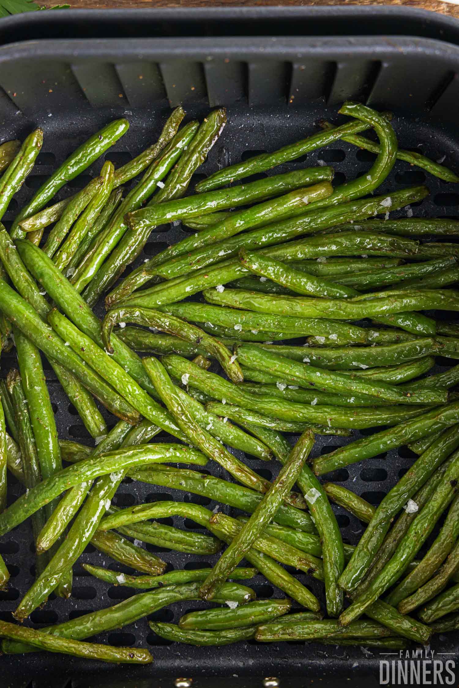 Air fryer green beans in the air fryer.