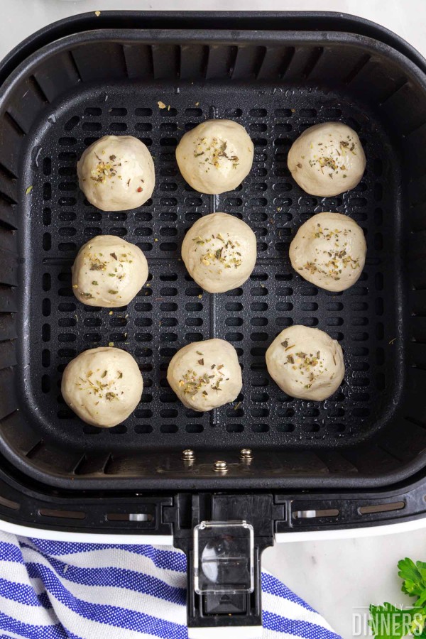 Biscuit balls in an air fryer basket