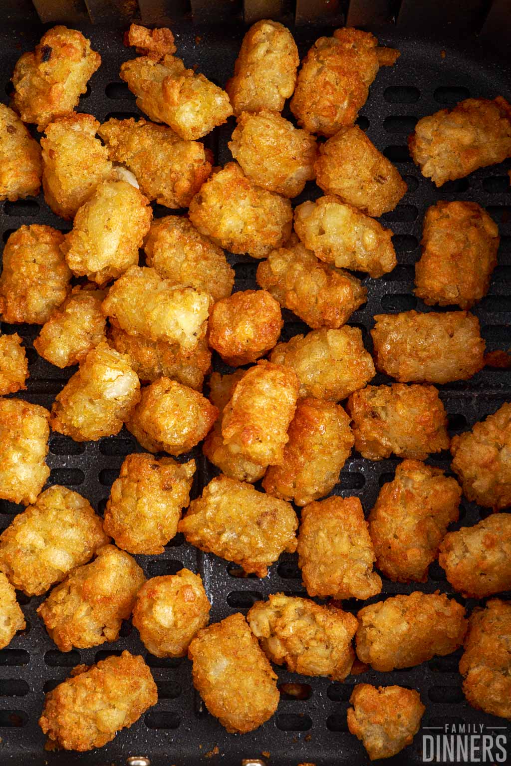 close up of cooked tater tots in the air fryer