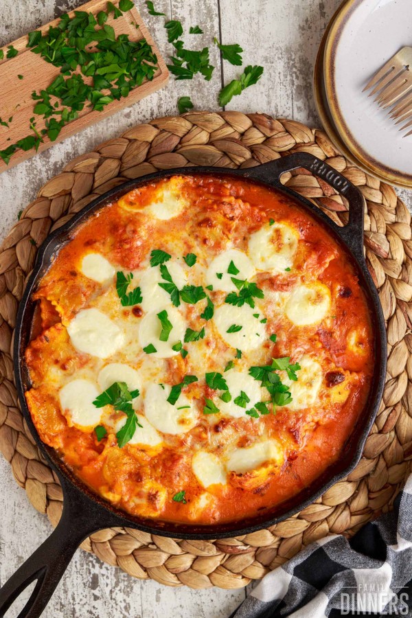 baked ravioli in a cast iron pan.