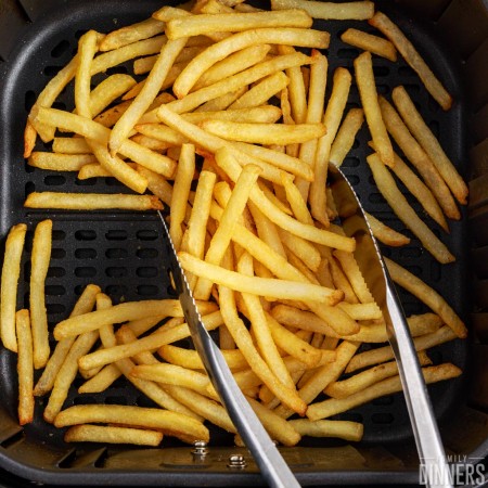 fries cooked in air fryer basket.