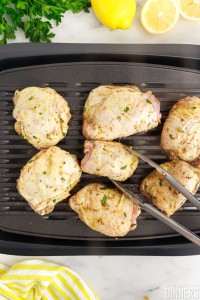 Raw chicken on a grill.