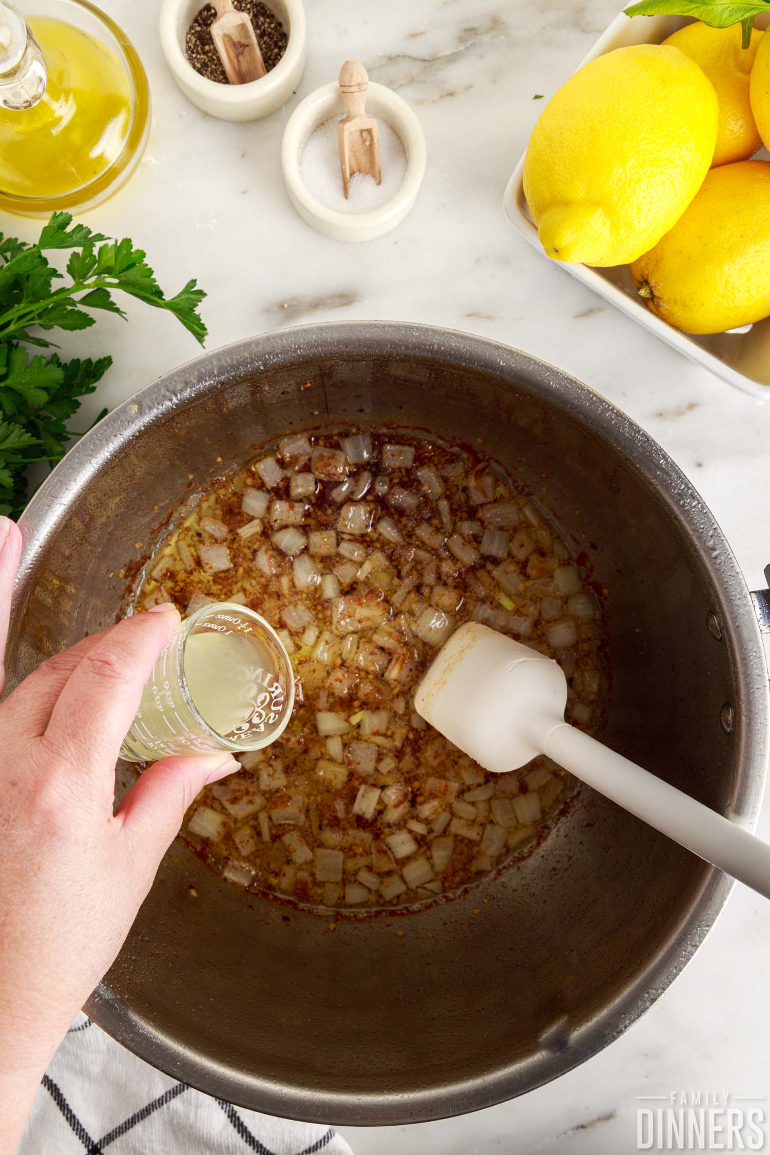 Adding lemon juice to sautéd onions in Instant Pot.
