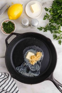 Butter and garlic in a cast iron pan.