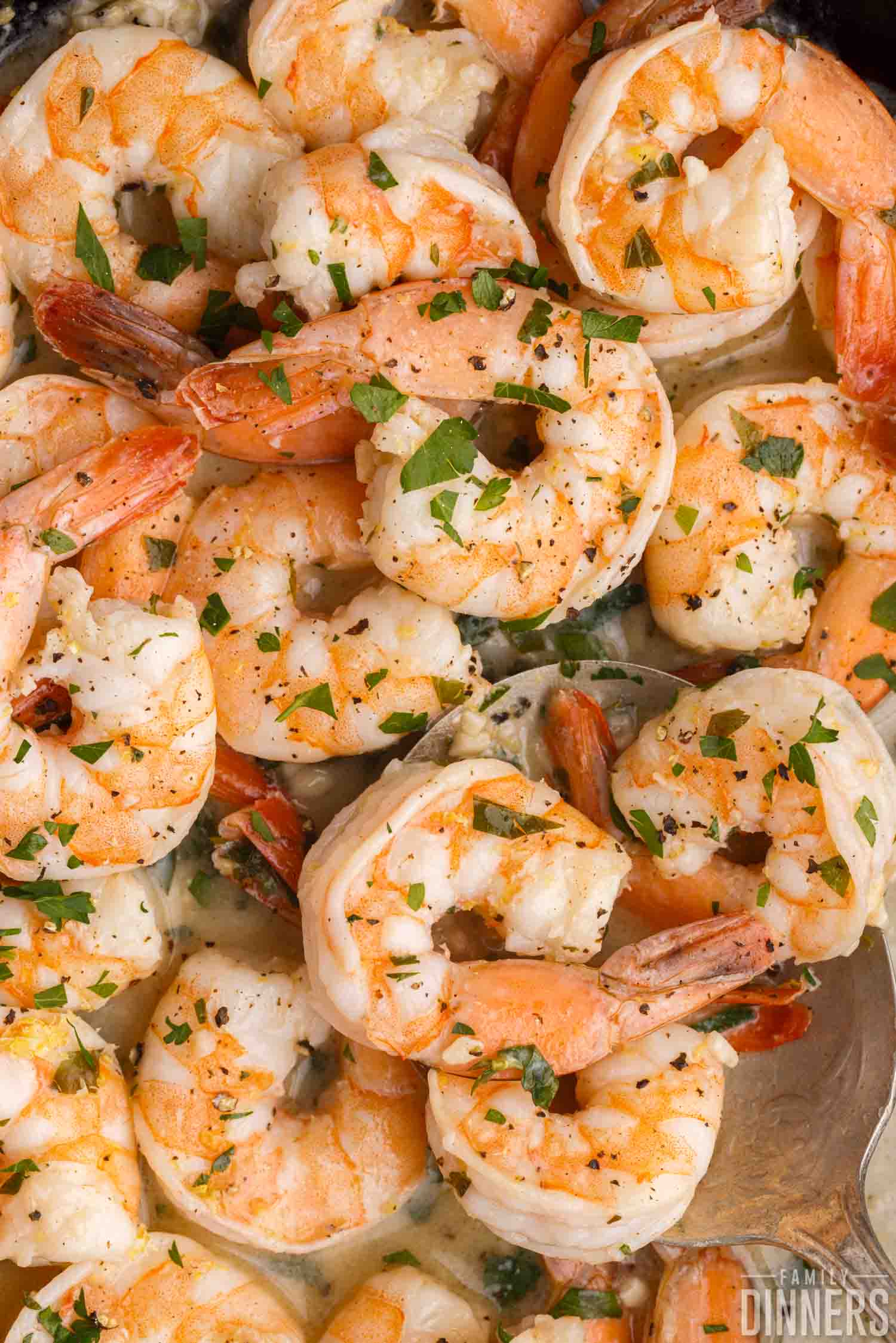 Skillet full of lemon butter shrimp.