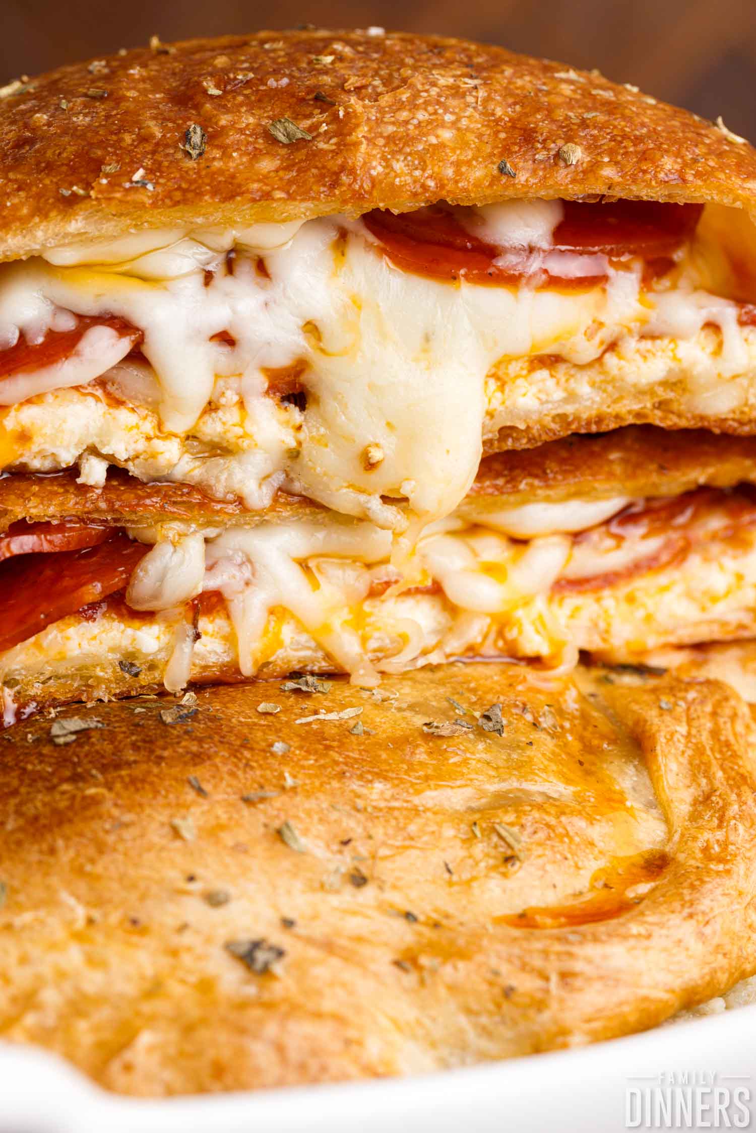 stack of pepperoni calzones with cheese.