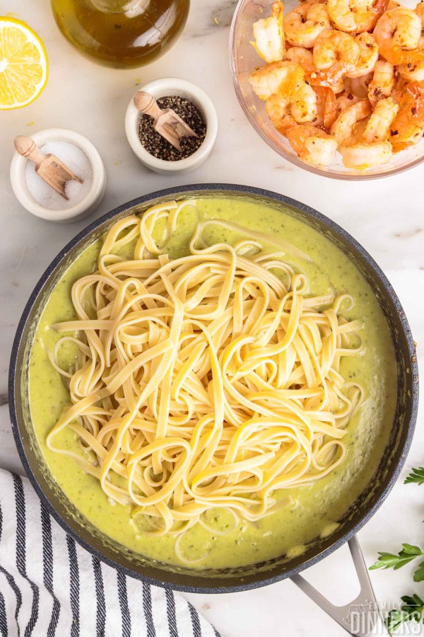 Noodles added to creamy lemon garlic sauce.