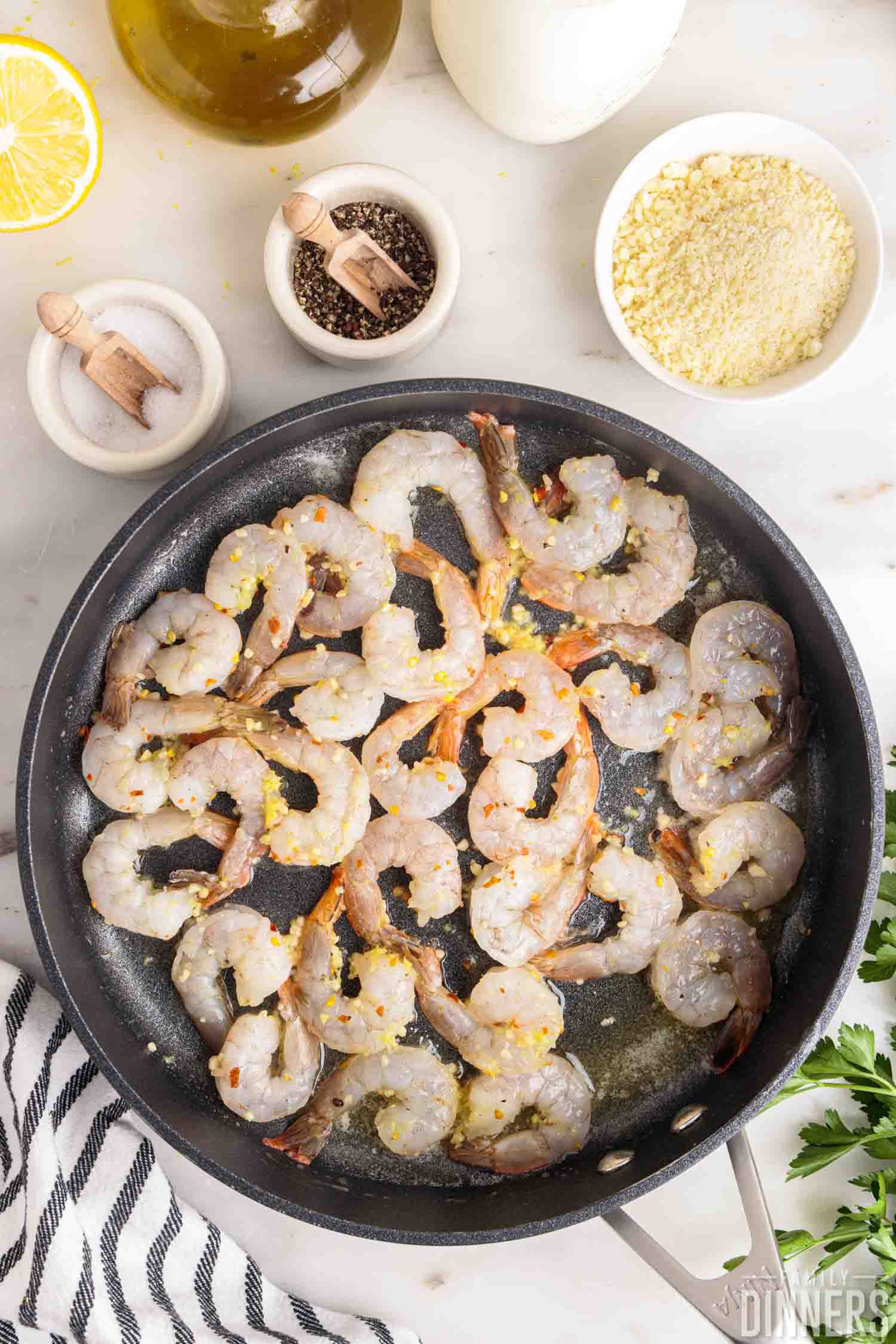 raw shrimp placed into pan.