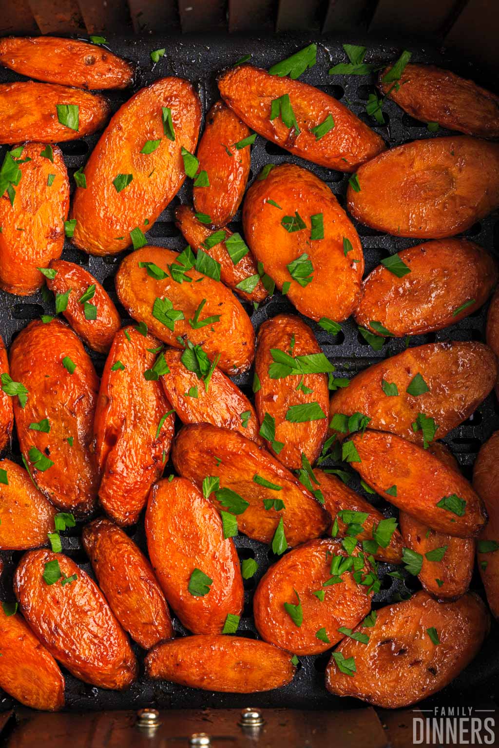 cooked carrots in the air fryer sprinkled with parsley