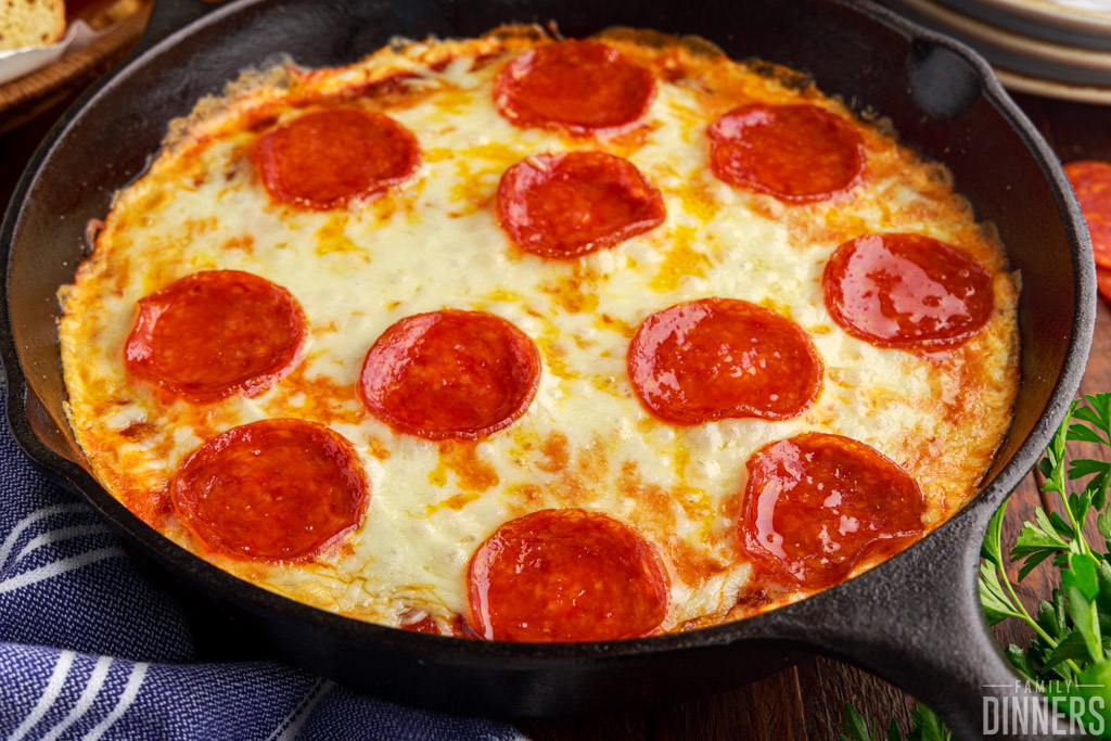 hot pizza dip in a cast iron skillet