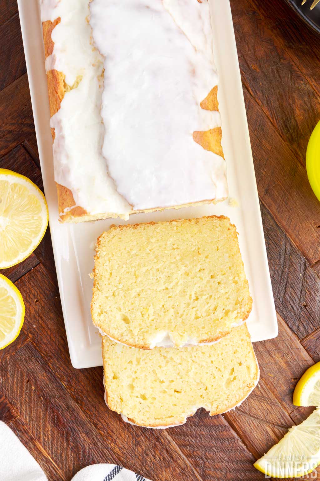 sliced limoncello cake loaf on a cutting board.
