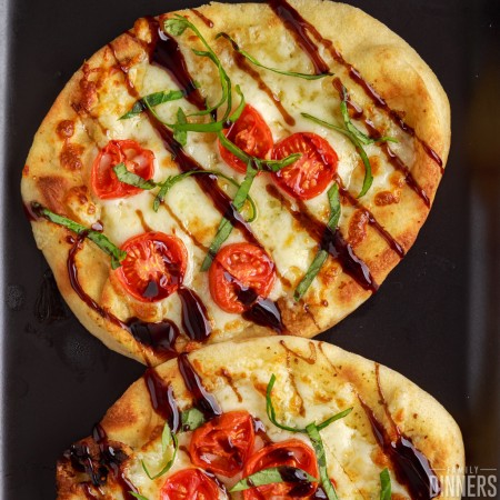 air fryer naan pizza with caprese topping.