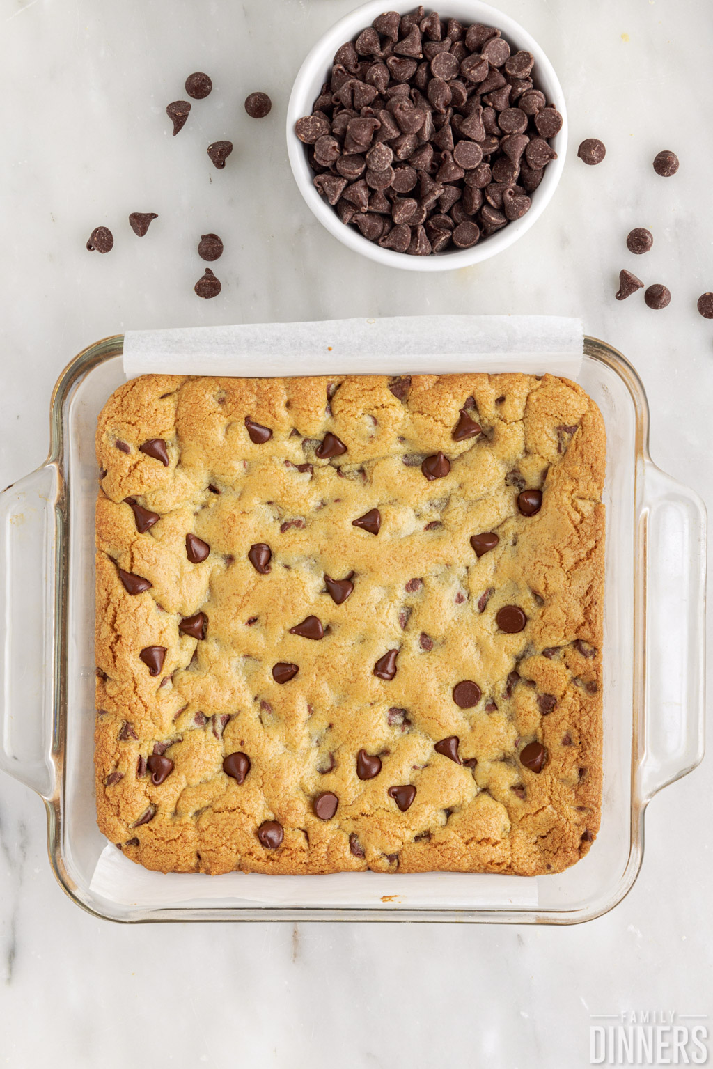 baked chocolate chip cookie bar in a baking dish