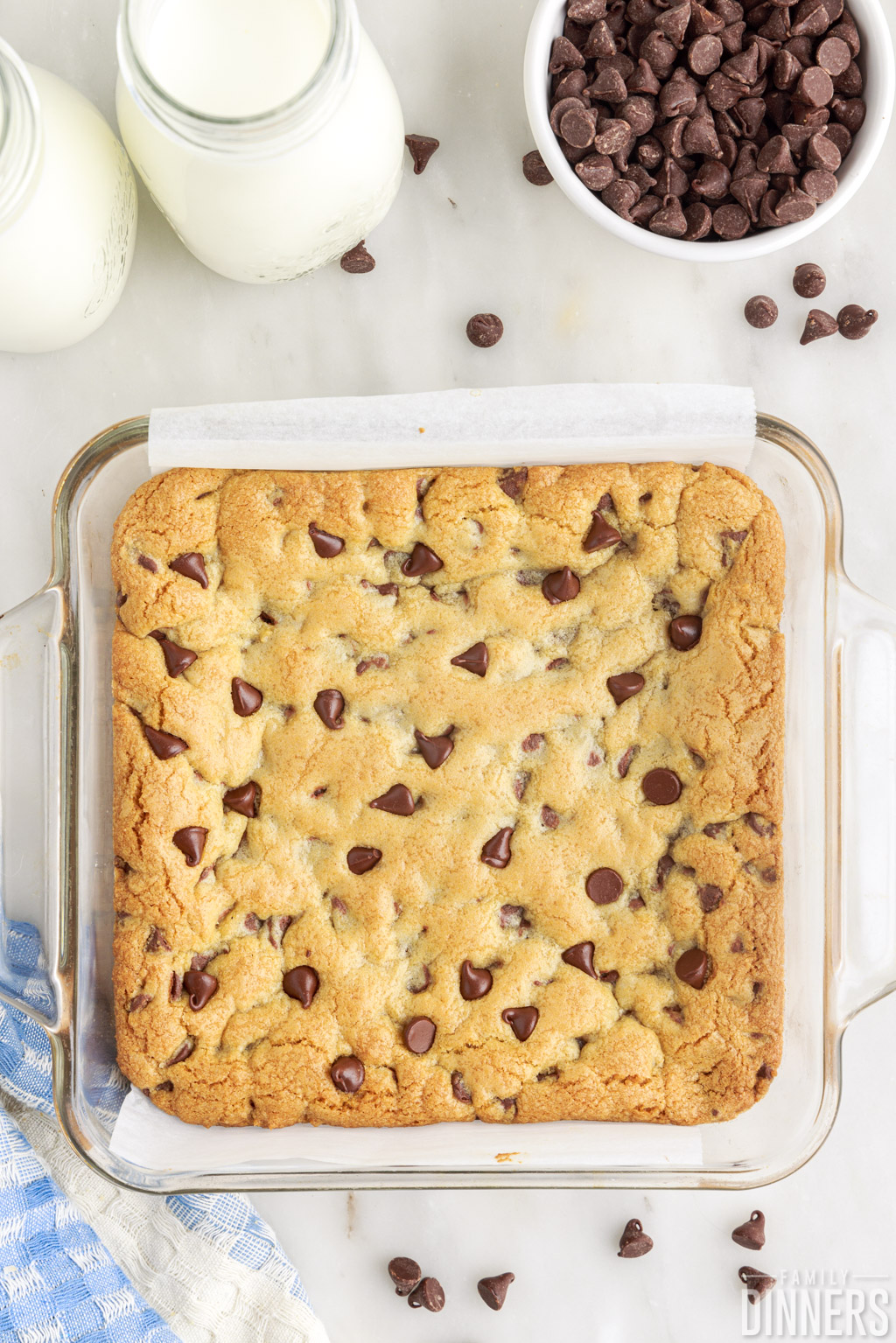 Cooked "better than toll house chocolate chip cookie bars" in a square pan.