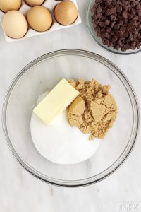 Butter and sugars in a bowl.