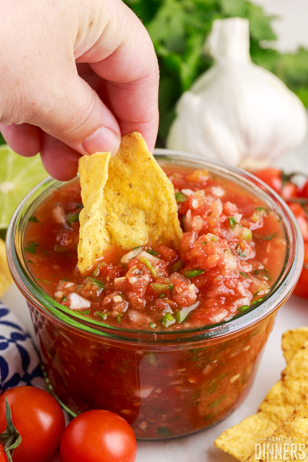 Chip dipping into the restaurant style salsa.